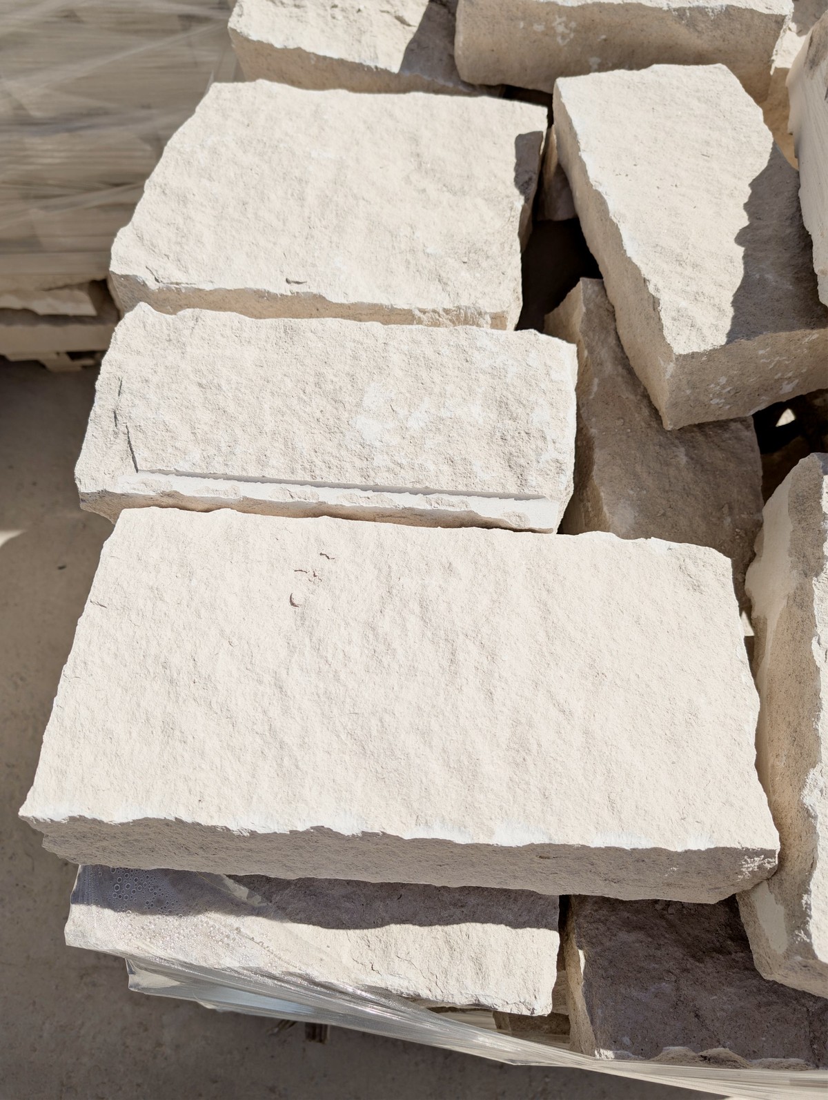 Ivory limestone, rectangular format, natural split-face surface