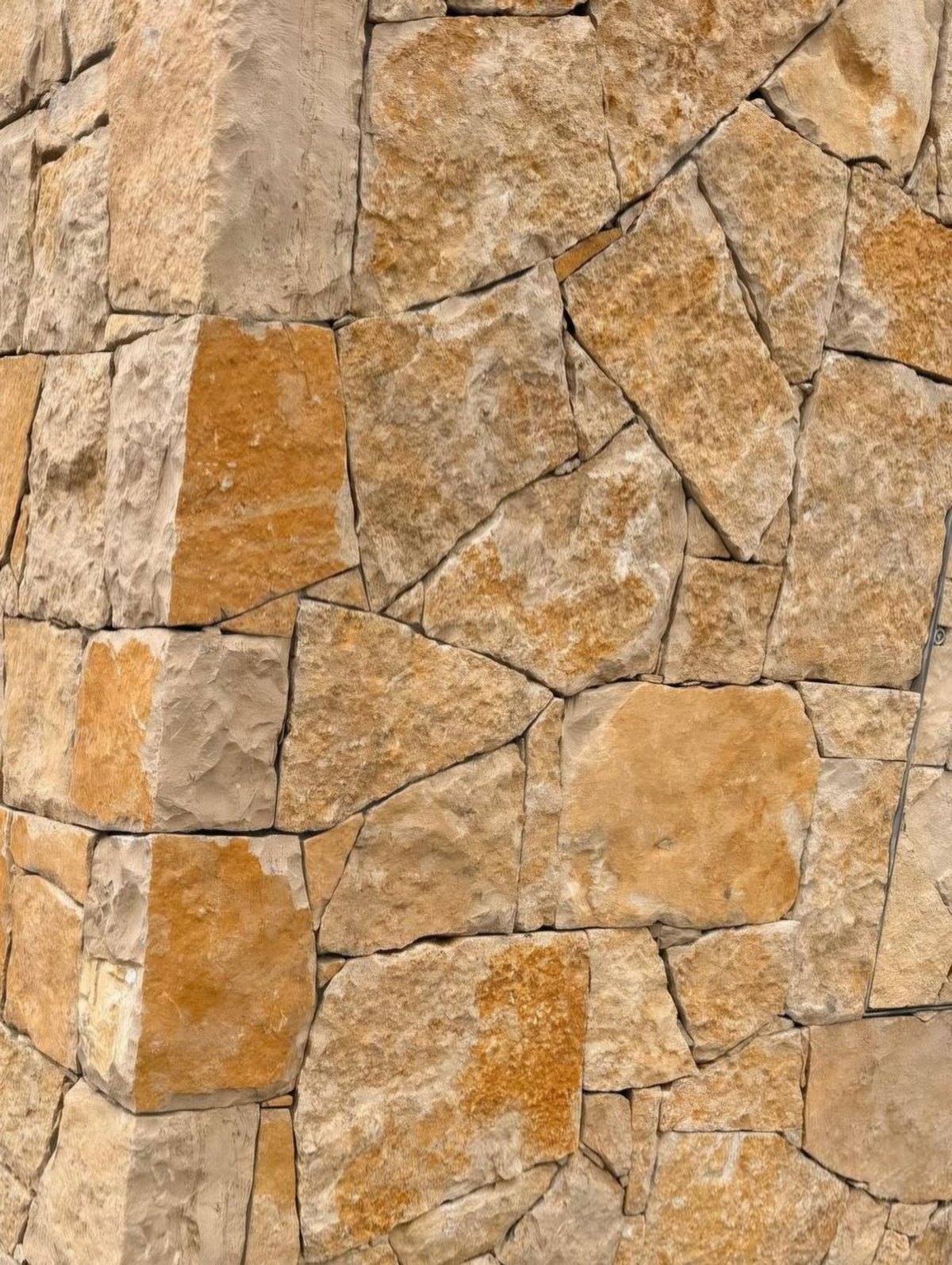 Golden-ochre limestone, irregular format, natural split-face surface